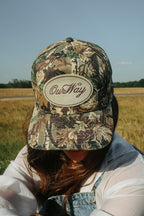 OurWay Camo Trucker Hat —structured trucker cap - custom patch on the front